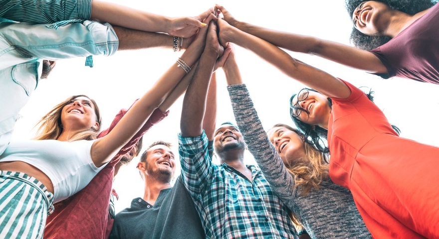 Young millenial friends stacking hand on high five move multiracial picture id1209489803